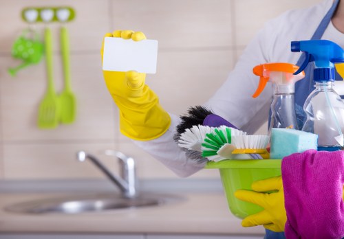 Cleaner making a bed during an Airbnb cleaning turnover