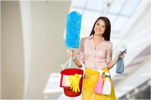 Technician using carpet cleaning equipment on a rug