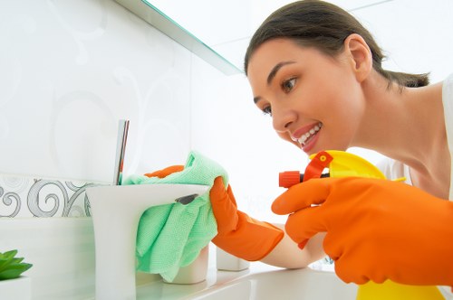 Vacuuming and dusting hidden areas during deep cleaning
