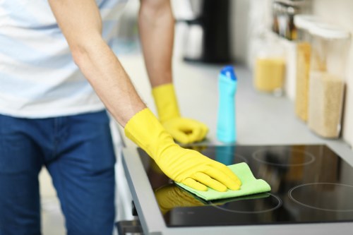 Streak-free glass being cleaned with a squeegee and microfiber cloth