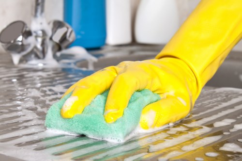 Professional move out cleaning of a kitchen with polished appliances